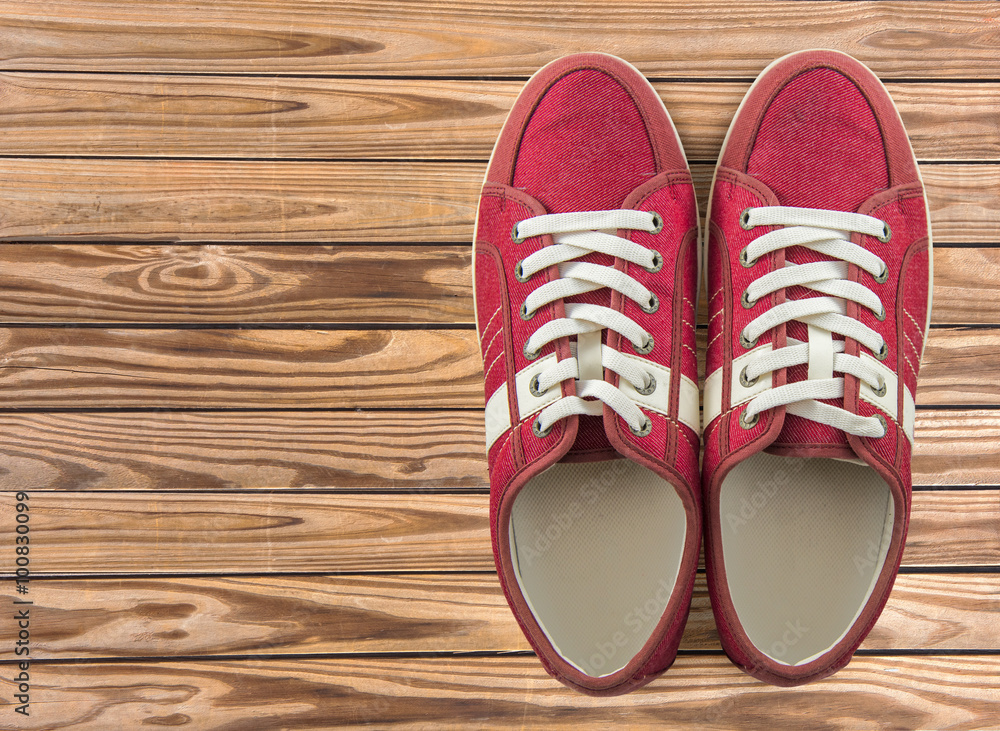 colorful shoes set on wooden background with copy space. Top view. colorful shoes set on wooden background with copy space. Top view.
