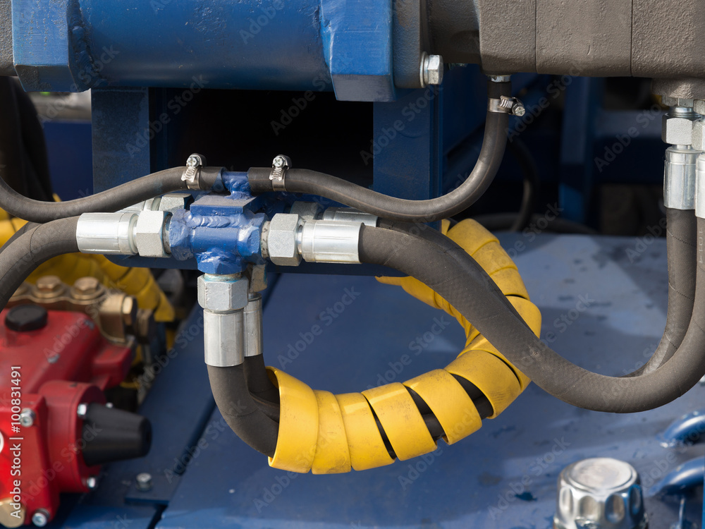 Hydraulic tubes, fittings and levers on control panel of lifting Hydraulic tubes, fittings and levers on control panel of lifting