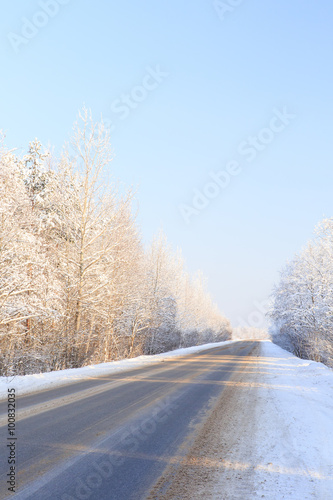 Winter road through snowy forests © kkolosov