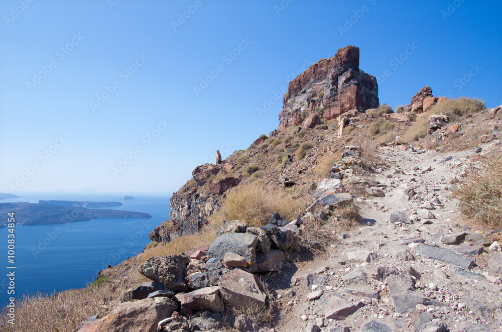 Santorini - The look to Skaros castle with the Nea Kameni island in the ...