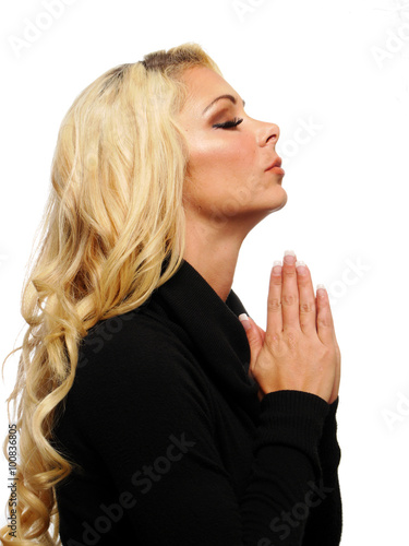 Blond woman praying