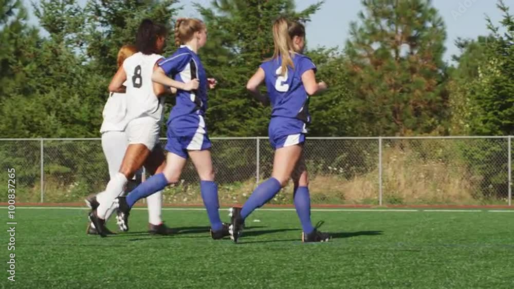 Female soccer players warm up before a game Female soccer players warm up before a game