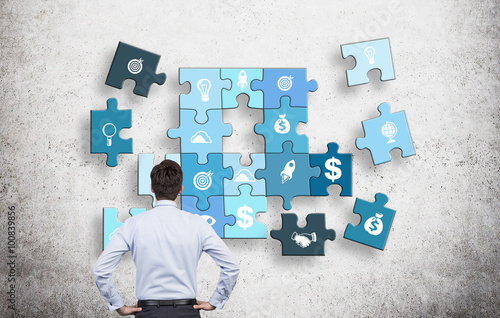 Canvas Print Man collecting a puzzle