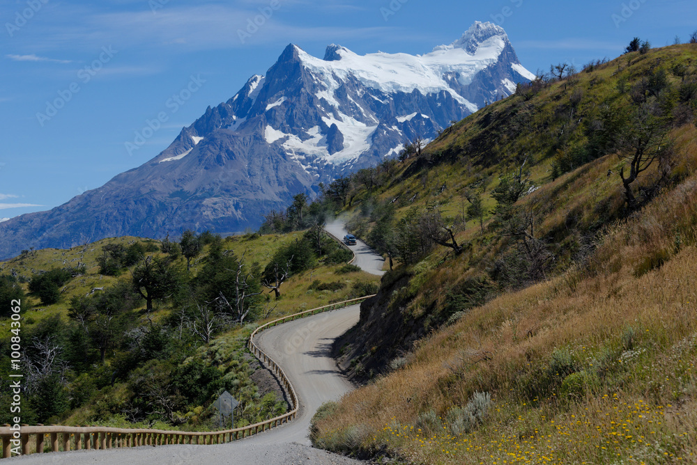 Gravel Road leading to the mountains, Torres del Paine, Chile.