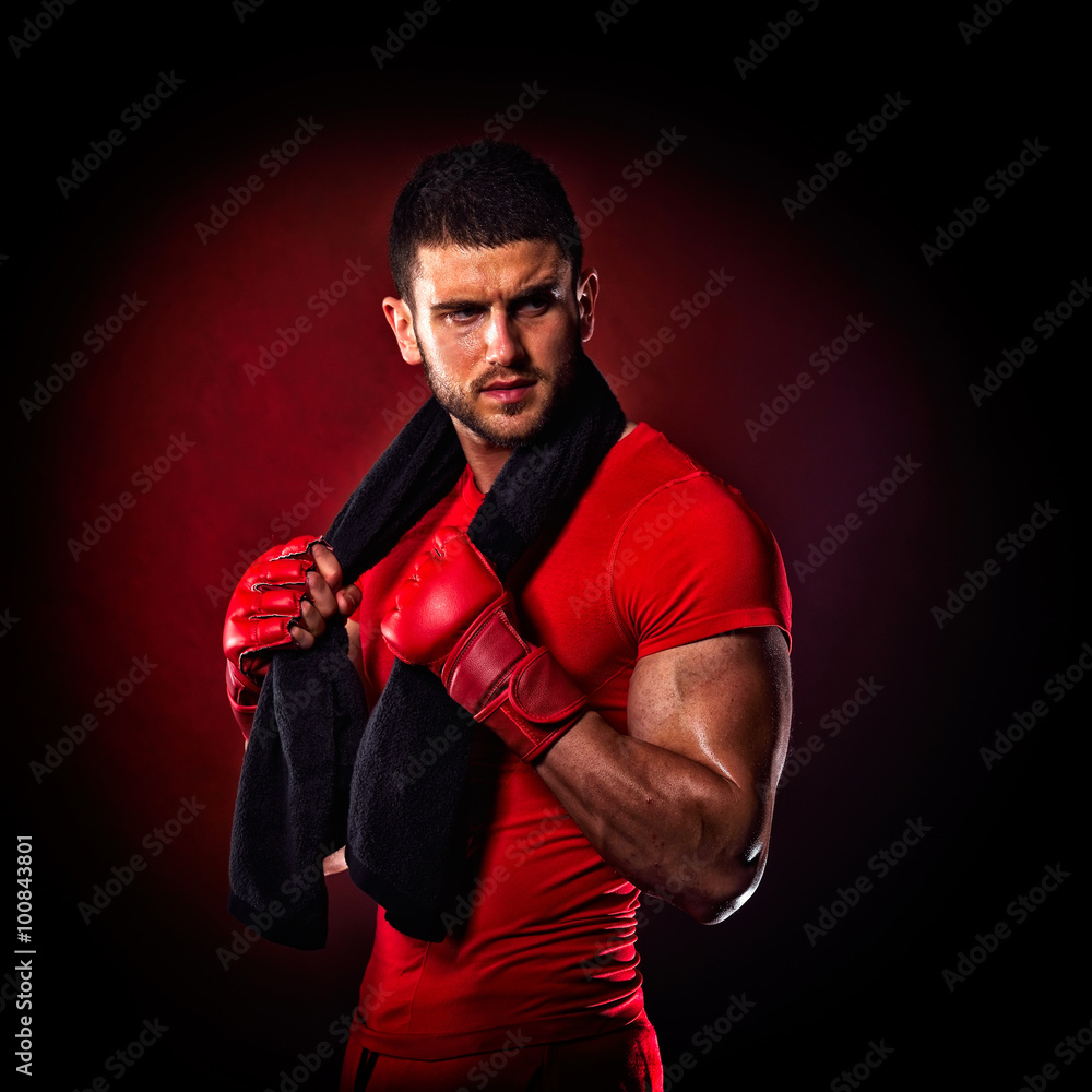 young man standing by bag boxing in studio young man standing by bag boxing in studio