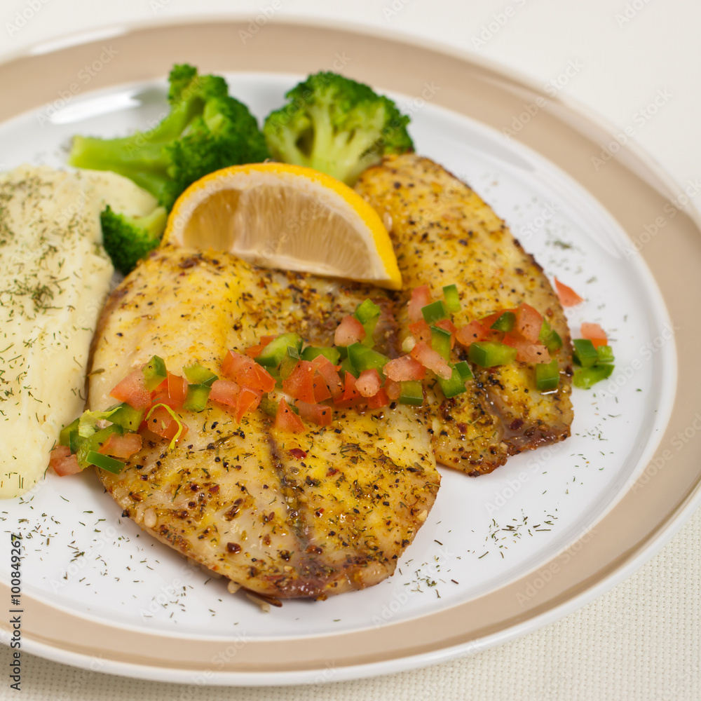 Baked white fish fillet and Mashed Potatoes. Selective focus. Baked white fish fillet and Mashed Potatoes. Selective focus.