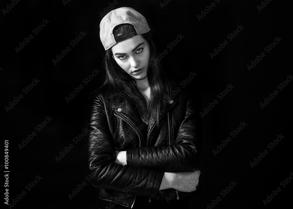Beautiful girl portrait wearing leather jacket and basket cap monochrome