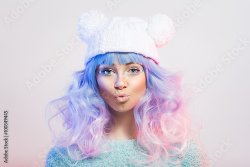 Cute young fashion woman with pastel purple and pink hair and makeup