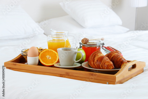 Breakfast in bed in hotel room.