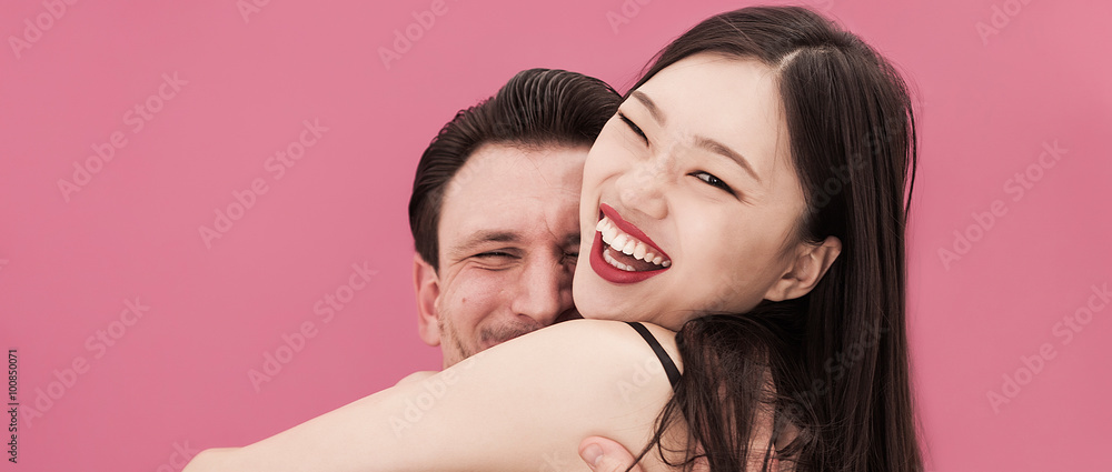 Beautiful couple portrait hugging and smiling letterbox Beautiful couple portrait hugging and smiling letterbox