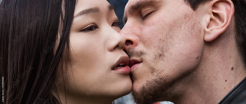 Beautiful couple in the city about to kissing letterbox Beautiful couple in the city about to kissing letterbox
