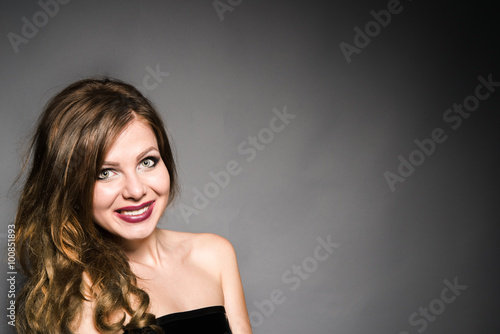 Beautiful brunette girl on dark background