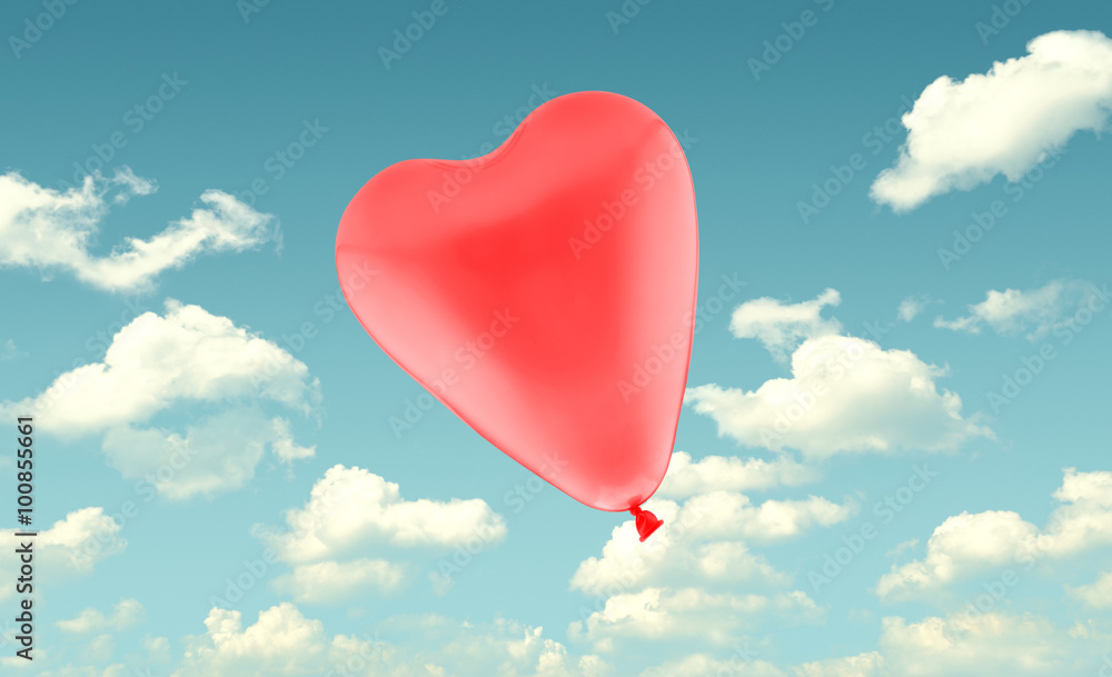 Red love heart balloon on blue sky background, valentine concept