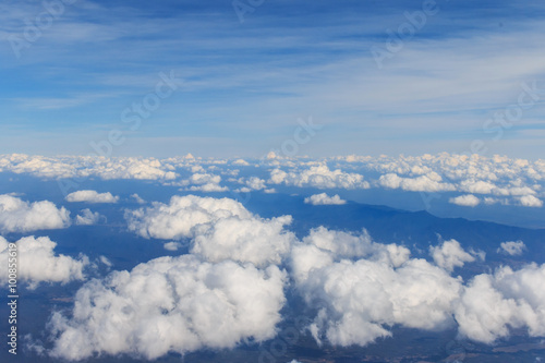 View of Beautiful Clouds and sky as seen through window of an aircraft