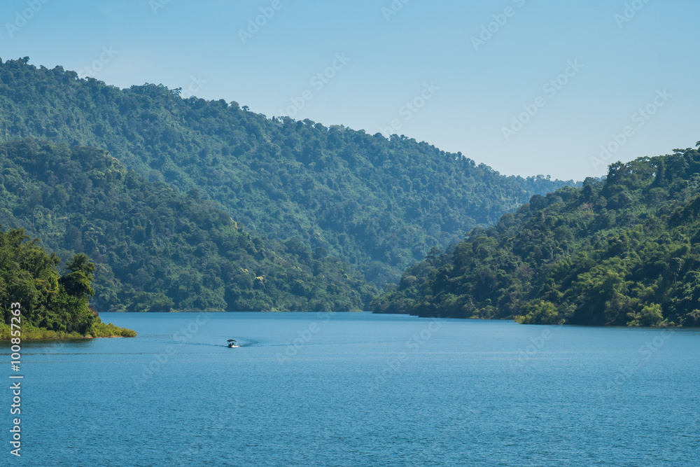 A blue lake, Mountain green forest and boat.