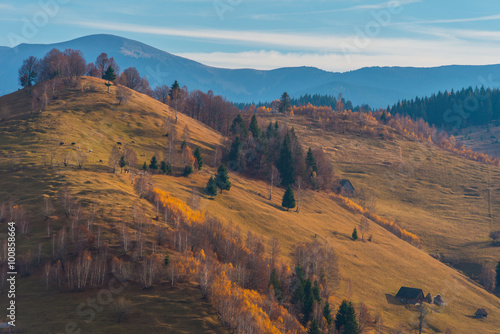 Autumn scenery in remote rural area in Transylvania and dramatic cloudy sky