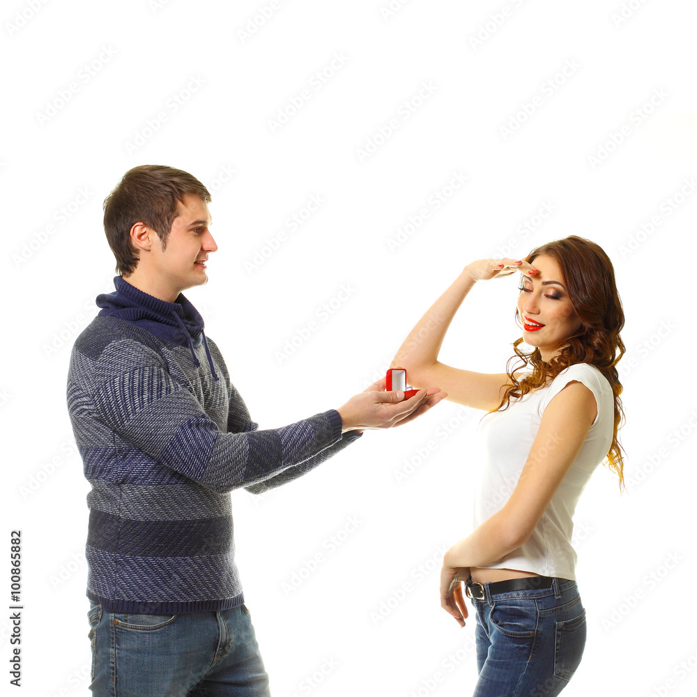 The young man makes a proposal to marry the girl. A man makes a gift to the woman he loves. The young man makes a proposal to marry the girl. A man makes a gift to the woman he loves.