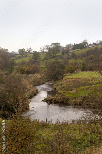 Peaceful Countryside. A small river runs through a little valley in the north of England. It creates a delightful little corner of the rural countryside.