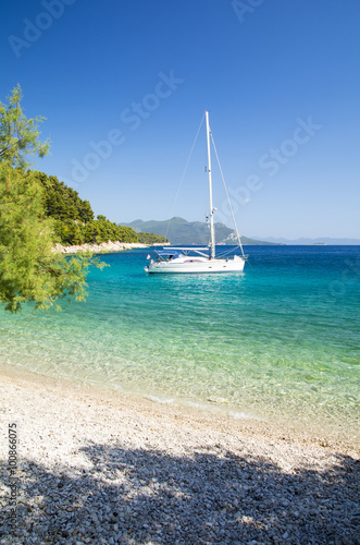 paradise beach and yacht on Peljesac peninsula in Dalmatia, Croatia