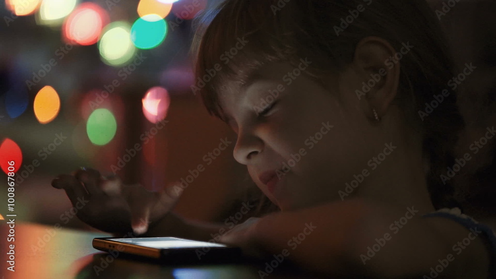 Little Girl viewing Photos on Smartphone Little Girl viewing Photos on Smartphone