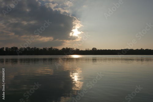 Half cloudy river sunset.