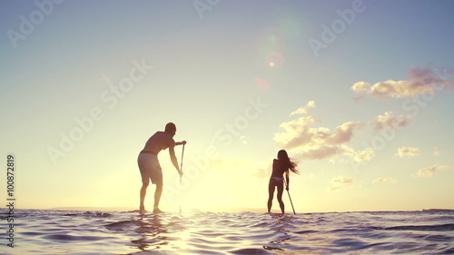 Wallpaper Mural Slow Motion Silhouette Happy Couple Stand Up Paddling Boarding In Ocean  Torontodigital.ca