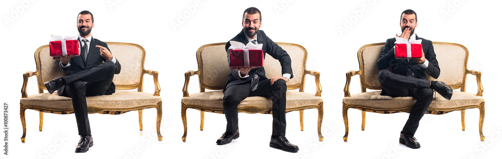 Businessman holding a gift