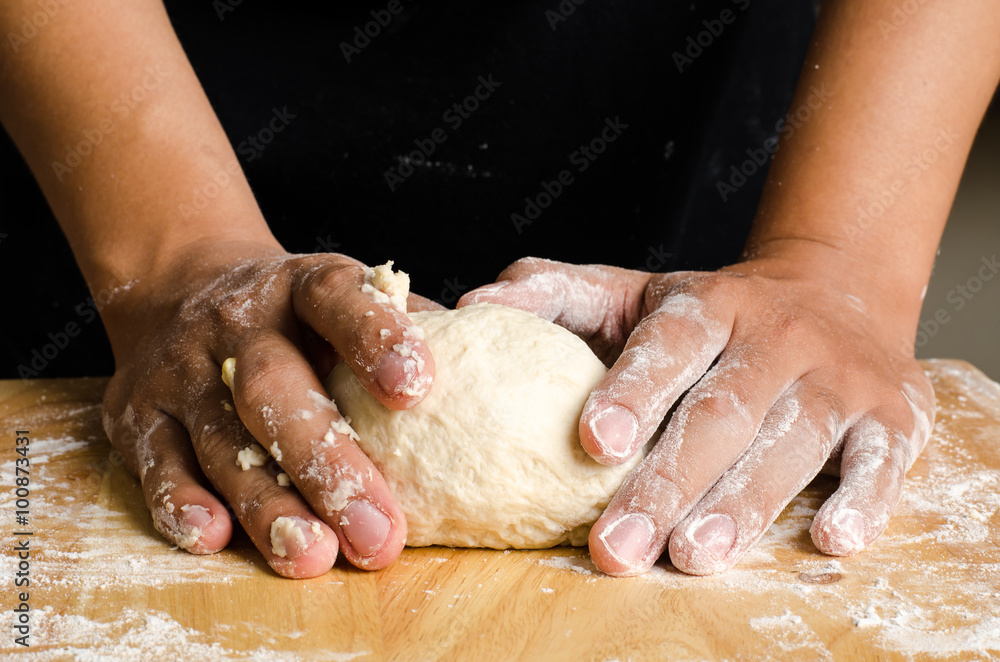 Kneading dough on wooden plate,bread cooking process