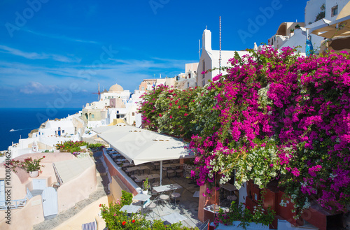 SANTORINI, GREECE - OCTOBER 5, 2015: The Oia and Therasia island in the background.