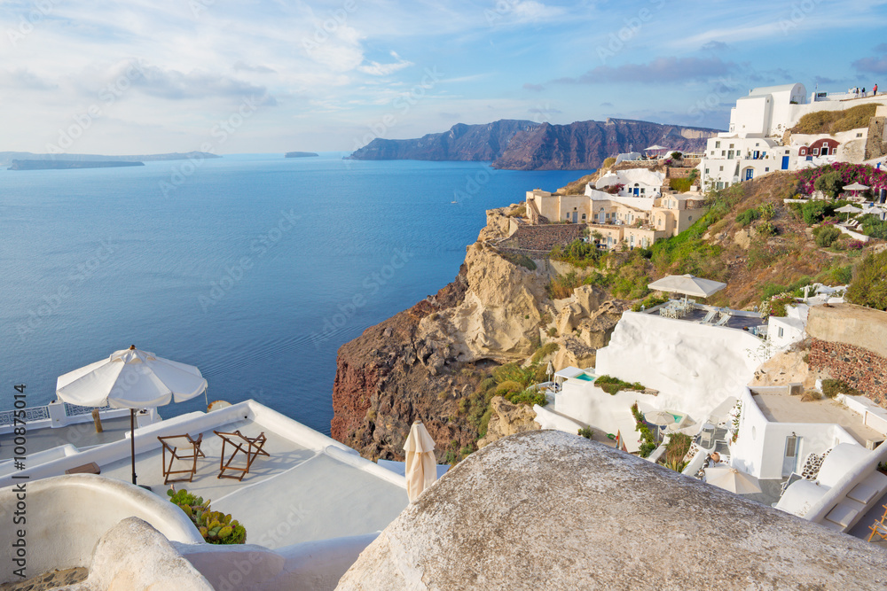 SANTORINI, GREECE - OCTOBER 5, 2015: The Oia and Therasia island in the background.