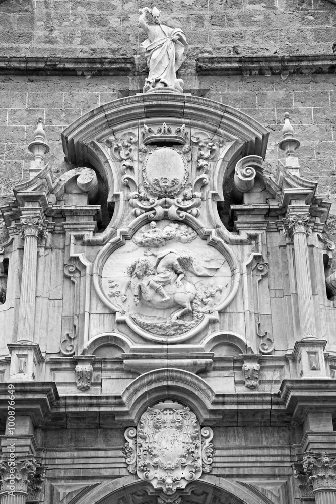 GRANADA, SPAIN - MAY 29, 2015: The detail of portal on church Iglesia de los santos Justo y Pastor designed by Jose Bada (1691 - 1755).