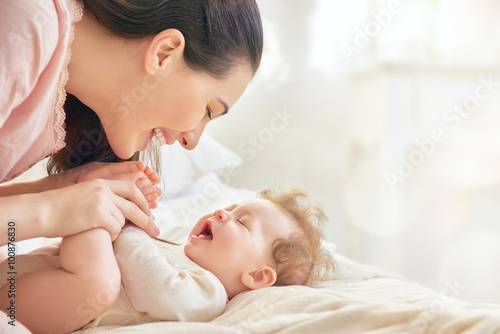 mother playing with her baby