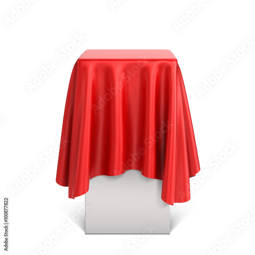 Presentation pedestal covered with a red silk cloth