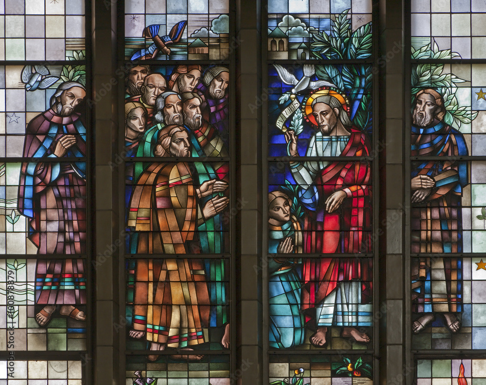 BRUSSELS - JUNE 22: Jesus benedicte the Apostle from windowpane of National Basilica of the Sacred Heart built between years 1919 - 1969 on June 22, 2012 in Brussels.