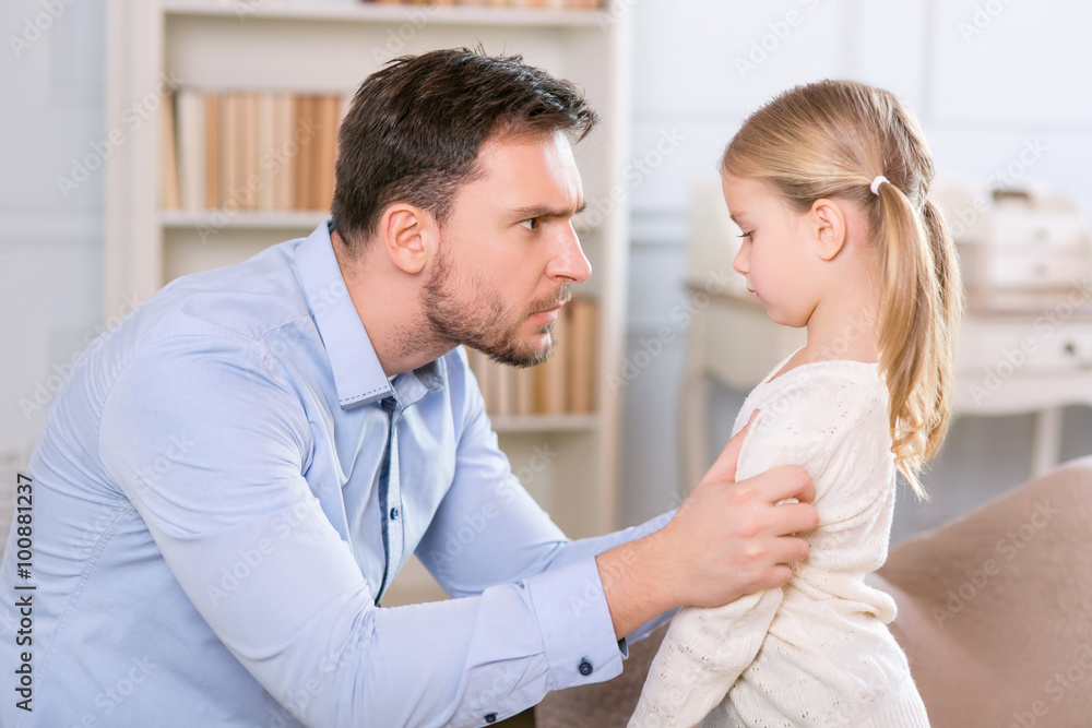 Strict father punishing his daughter Strict father punishing his daughter