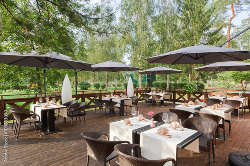 terrace restaurant in the park, with a table setting