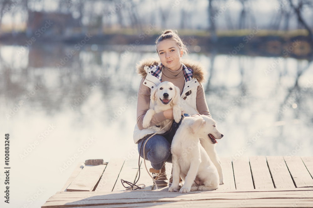 Beautiful girl with pets near the lake Beautiful girl with pets near the lake