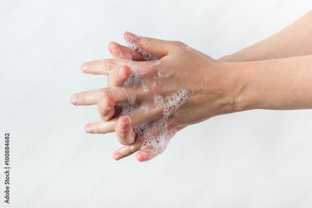 Fototapeta premium gesture of woman washing her hands on white background