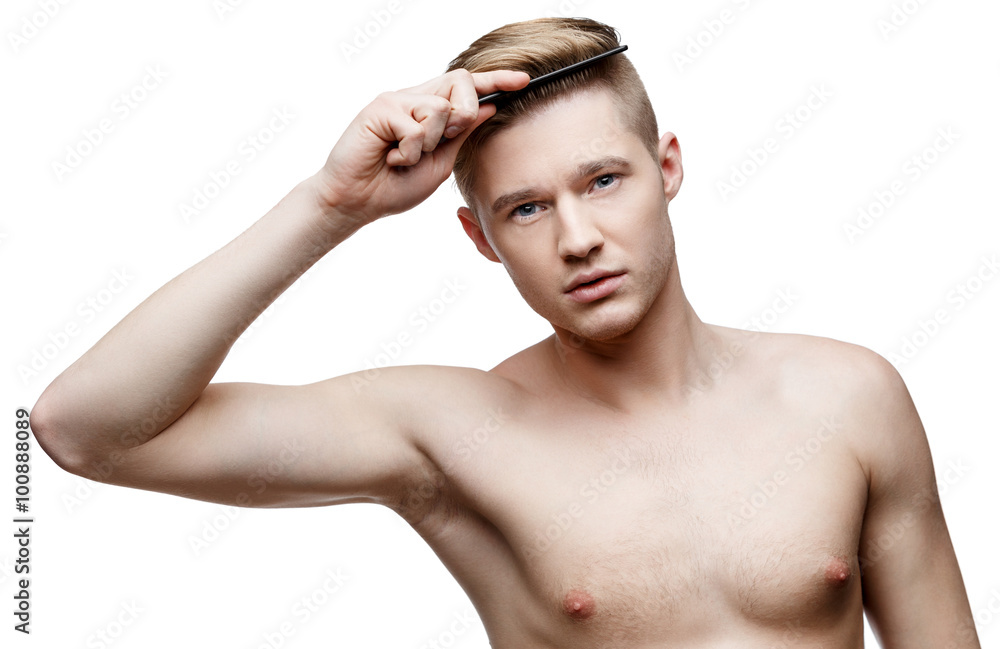 Young shirtless man isolated on white