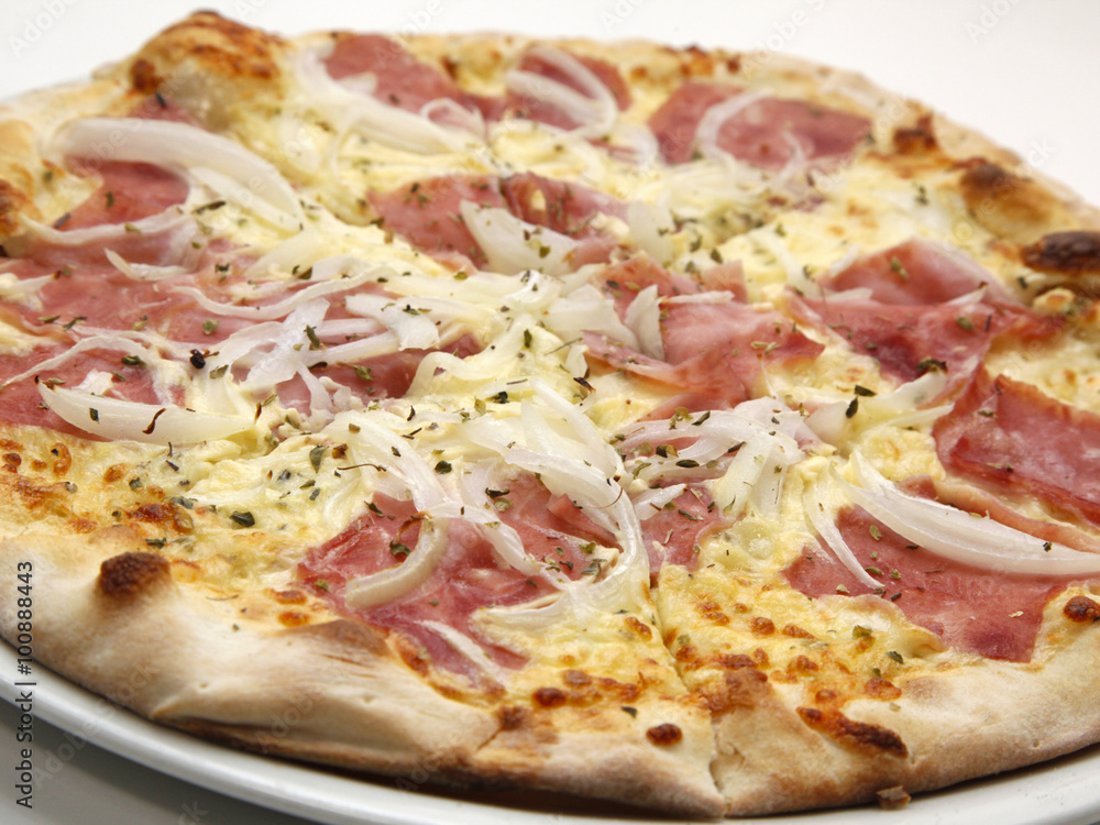 Delicious fresh pizza with ham and onions on white background
Delicious fresh pizza with ham and onions on white background