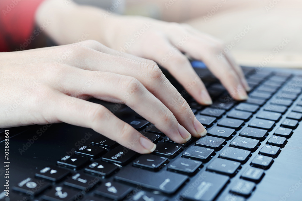 Woman typing on laptop Woman typing on laptop
