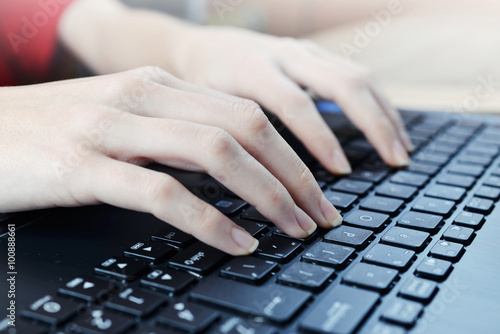 Woman typing on laptop