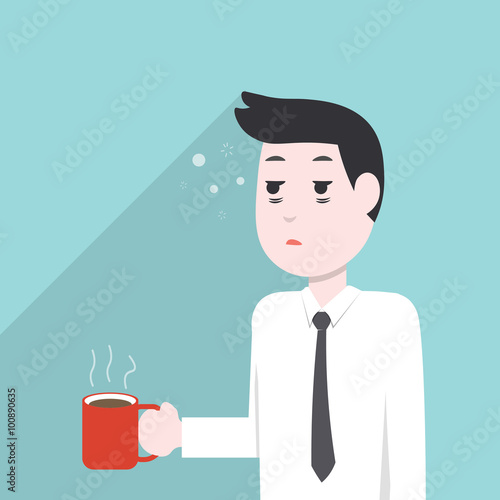 very sleepy and tired business man, holding a coffee mug
