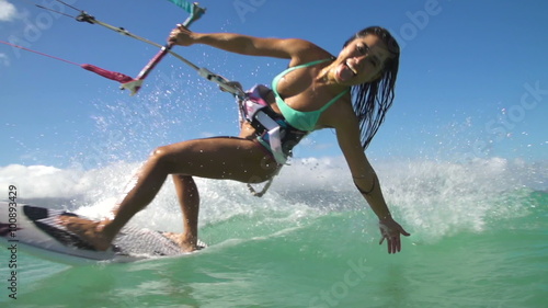 Young Woman Kitesurfing In Ocean, Extreme Summer Sport photo