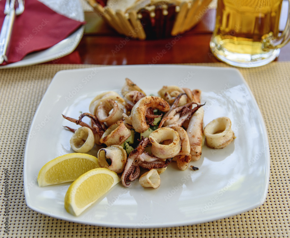 Fried squid stuffed with vegetables. Sea food Fried squid stuffed with vegetables. Sea food