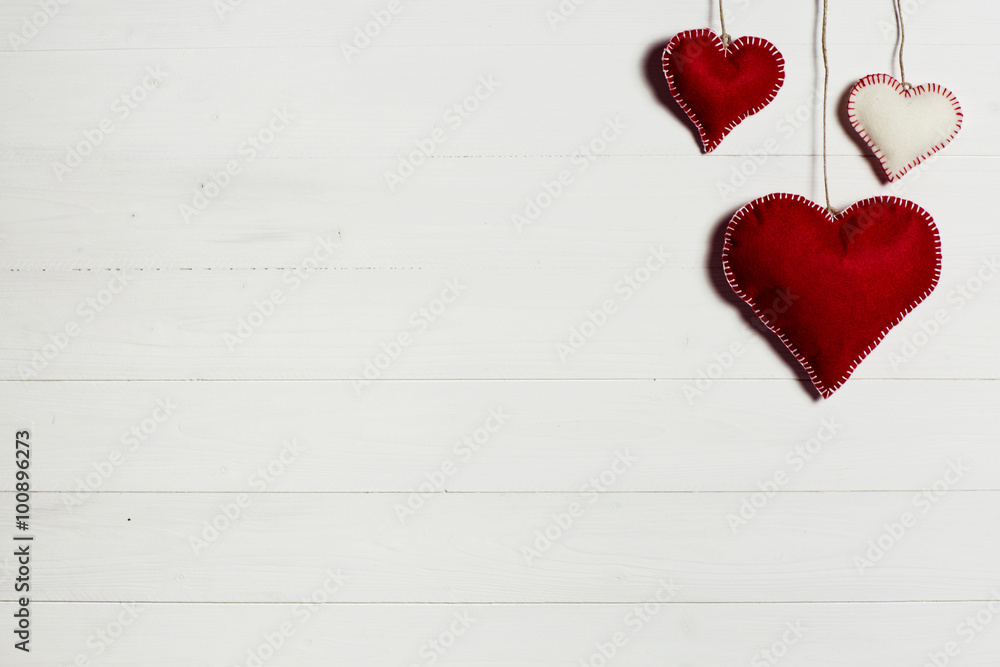 Valentine's Day background / Wooden background with red and white cloth hearts. Valentine's Day background / Wooden background with red and white cloth hearts.