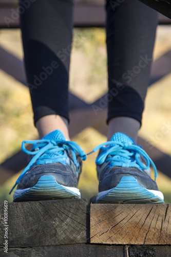 Running feet of young woman closeup on shoe