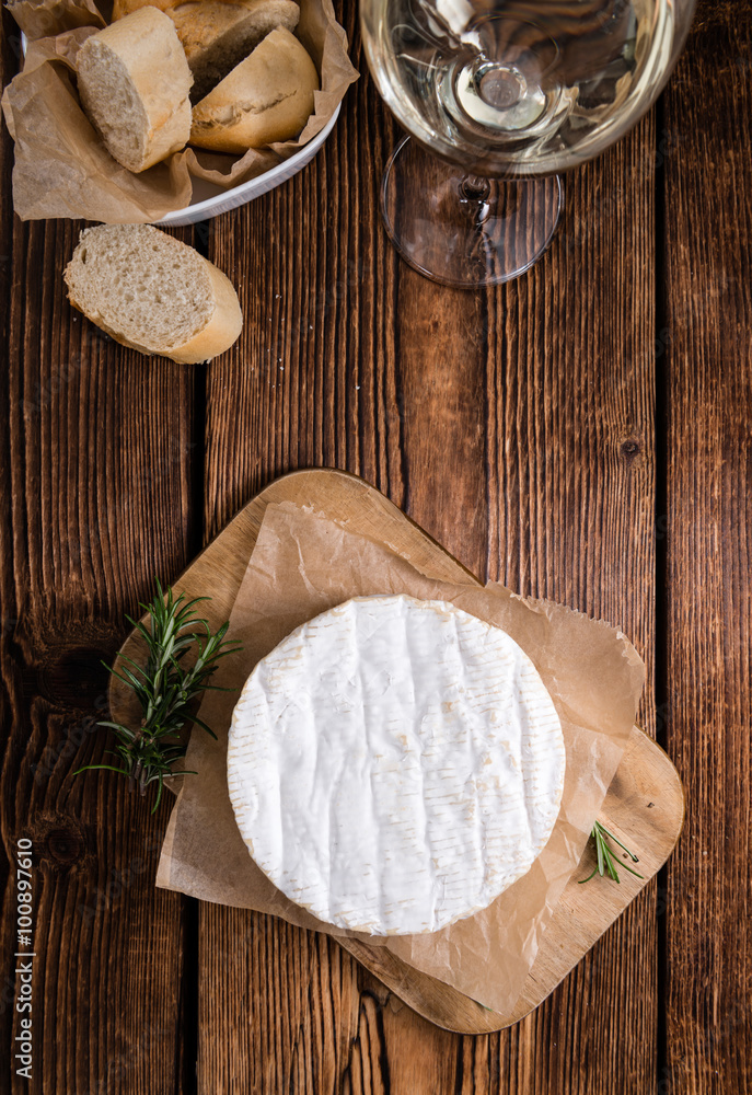 Creamy Camembert on wooden background Creamy Camembert on wooden background