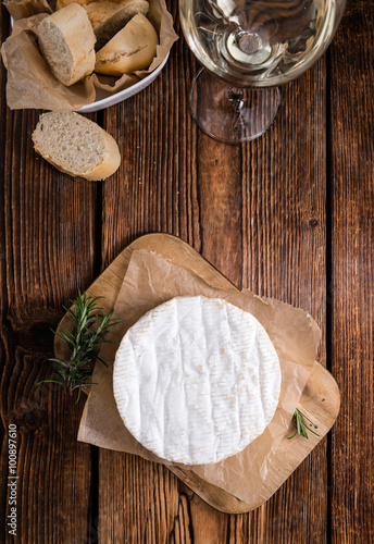 Creamy Camembert on wooden background