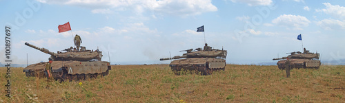 Merkava tanks and Israeli soldiers in training armored forces